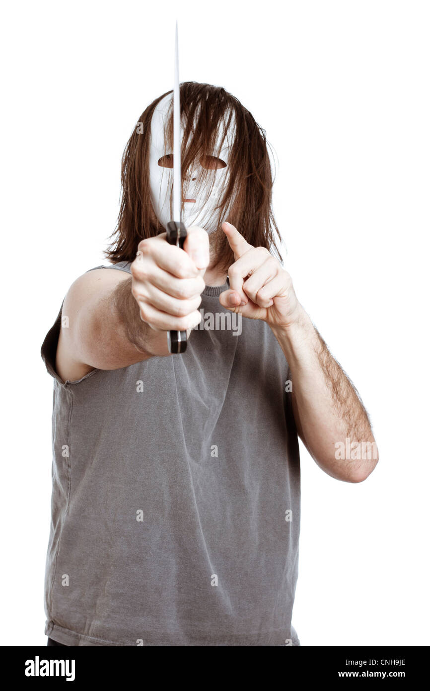 Horror scary masked menacing man with knife, isolated on white background. Stock Photo