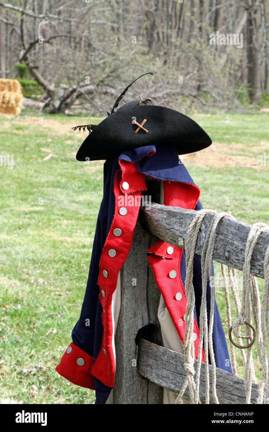 American Revolution Continental Army jacket and hat resting on a fence post in Jockey Hollow National Park, New Jersey, USA. Stock Photo
