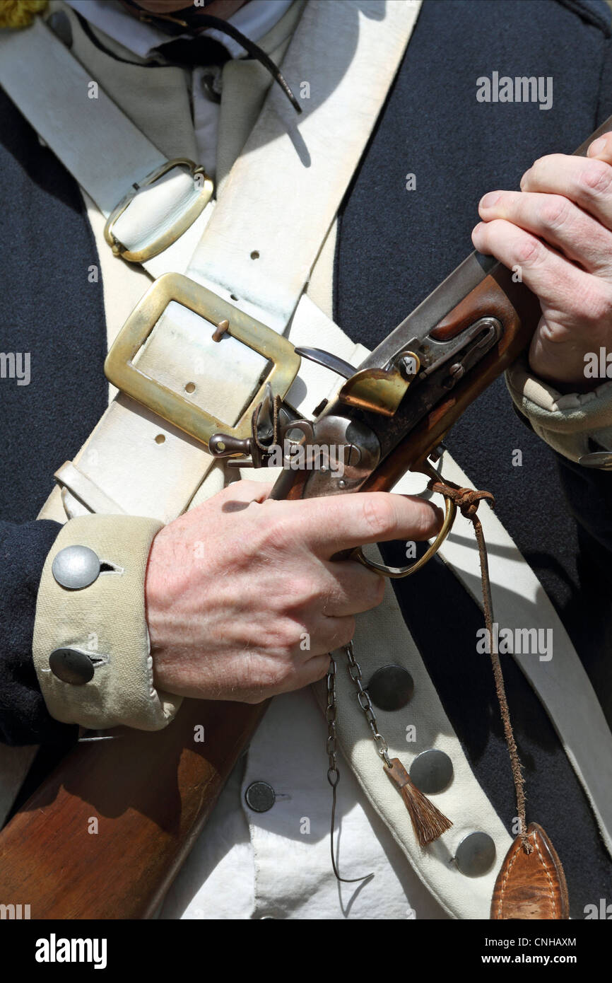 A close-up of a cocked musket rifle during a re-enactment of a United States Continental Army encampment. Morristown, NJ, USA Stock Photo