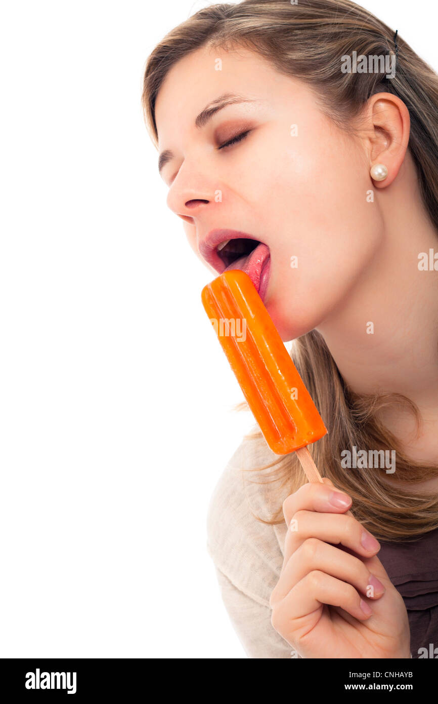 A fan licking an ice pop while watching the SA vs NZ T20 scorecard for a pivotal wicket
