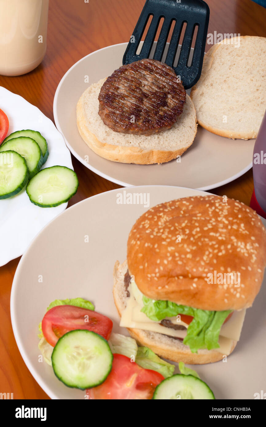 Detail of kitchen table and preparation of homemade hamburgers. Stock Photo