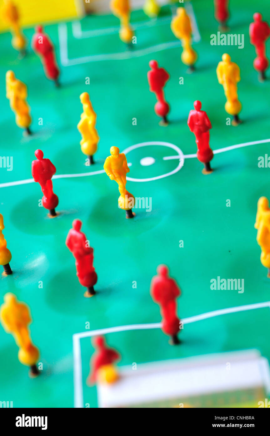 Macro shoot of red and yellow players of tabletop football game. Stock Photo