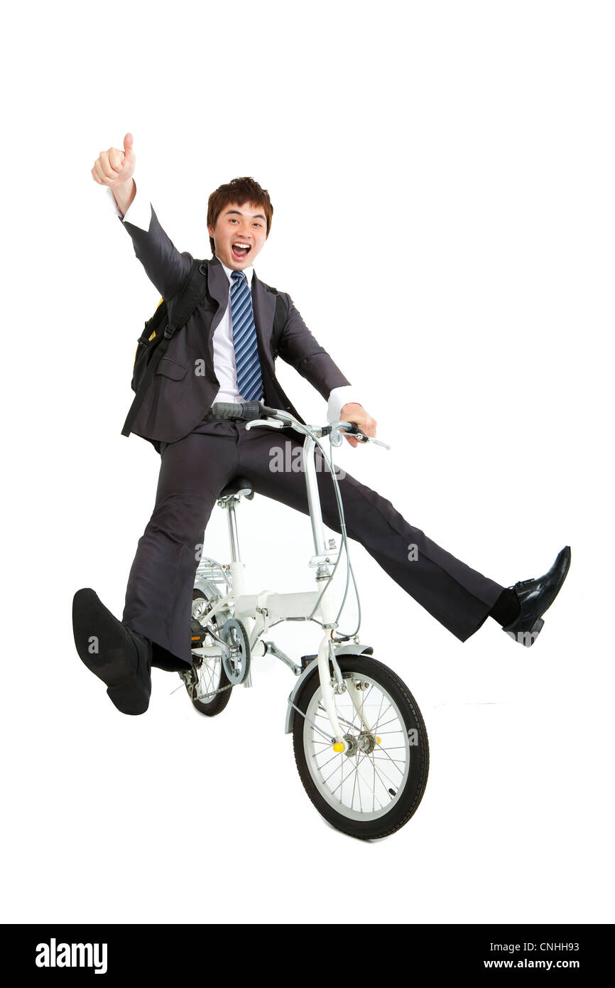 Happy asian businessman on a bicycle isolated on white background Stock Photo