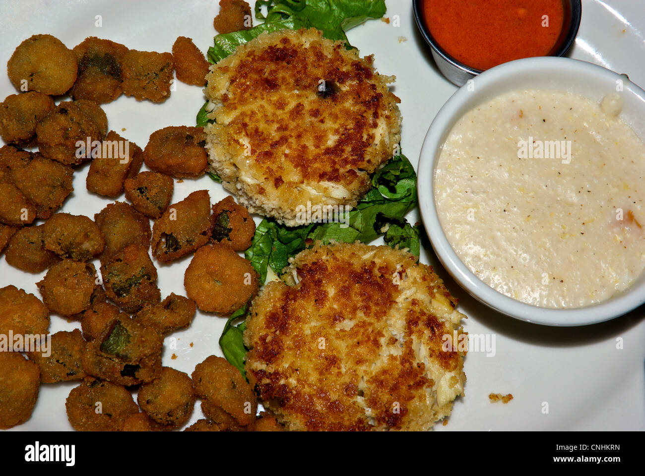 Deep fried battered okra Panko crusted crab cakes bowl cheese grits