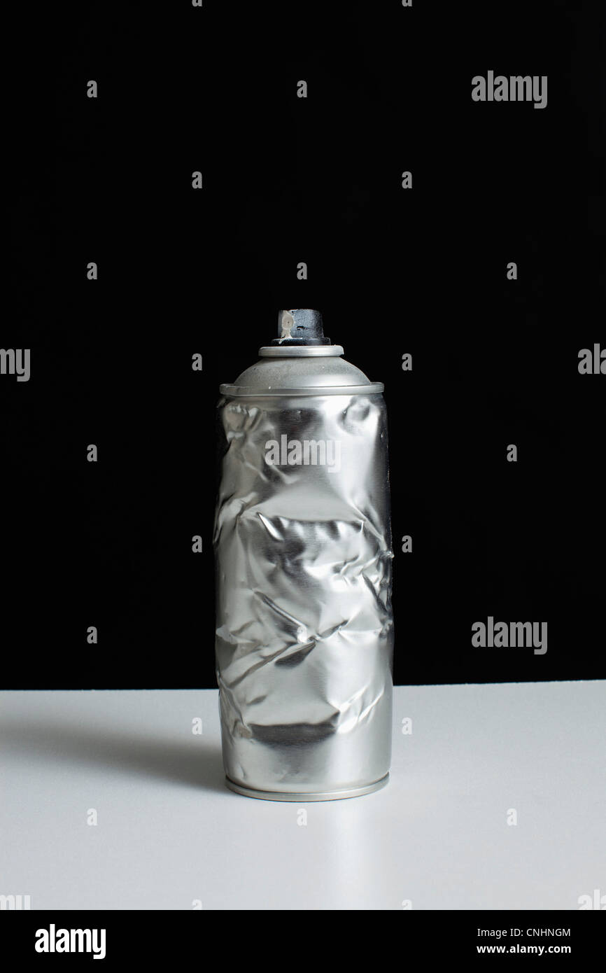 A damaged spray paint can Stock Photo