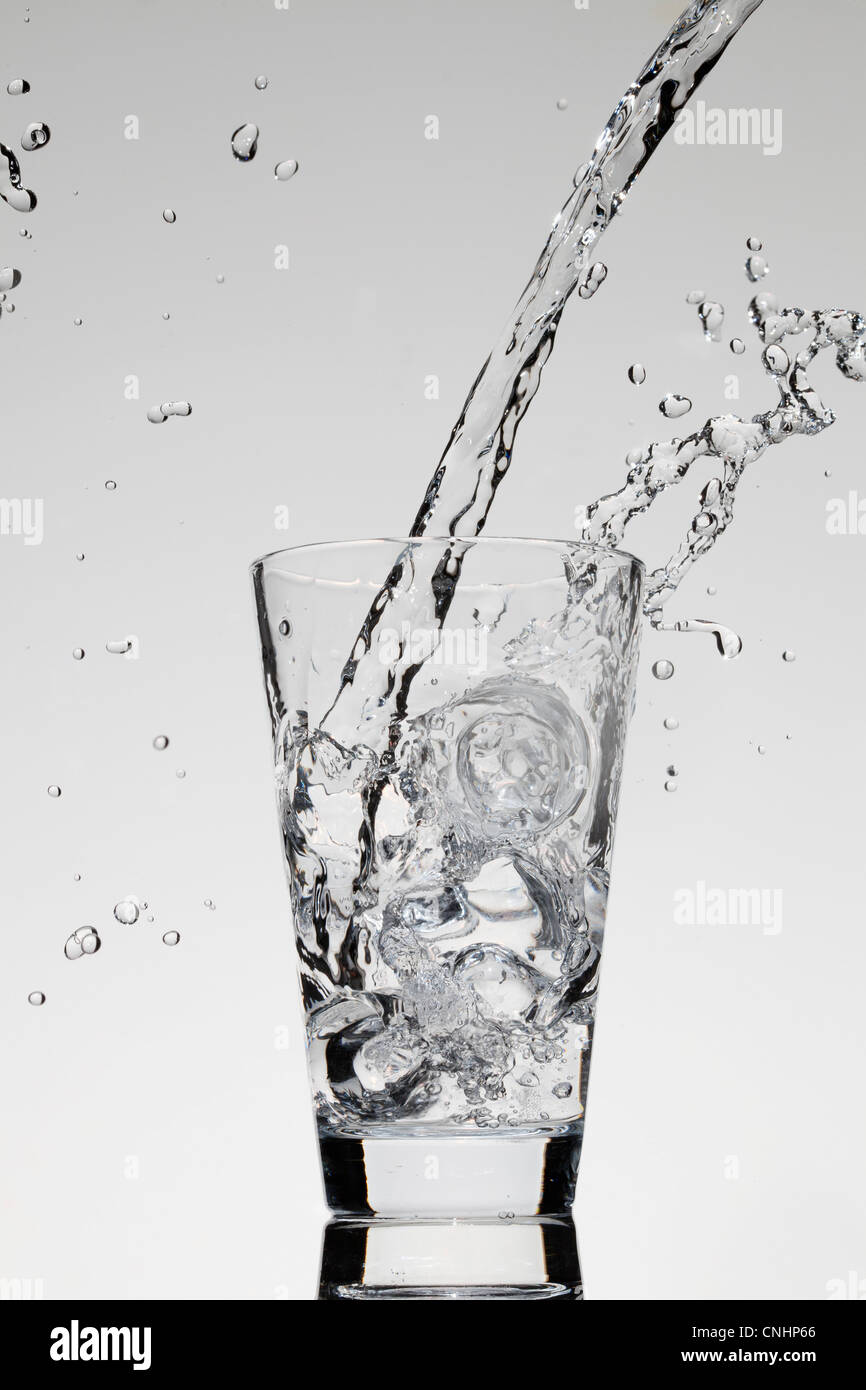 Water being poured into a glass Stock Photo Alamy