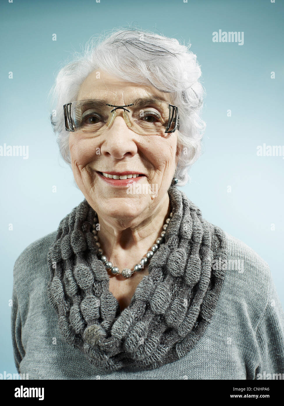 An elegant senior woman smiling at the camera Stock Photo - Alamy