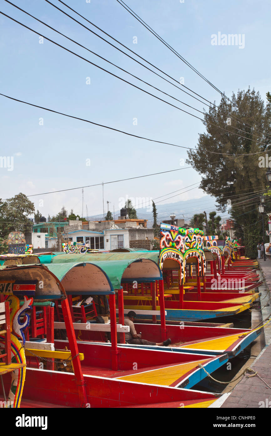A row of moored Trajineras, a traditional gondola type Mexican tour boat Stock Photo