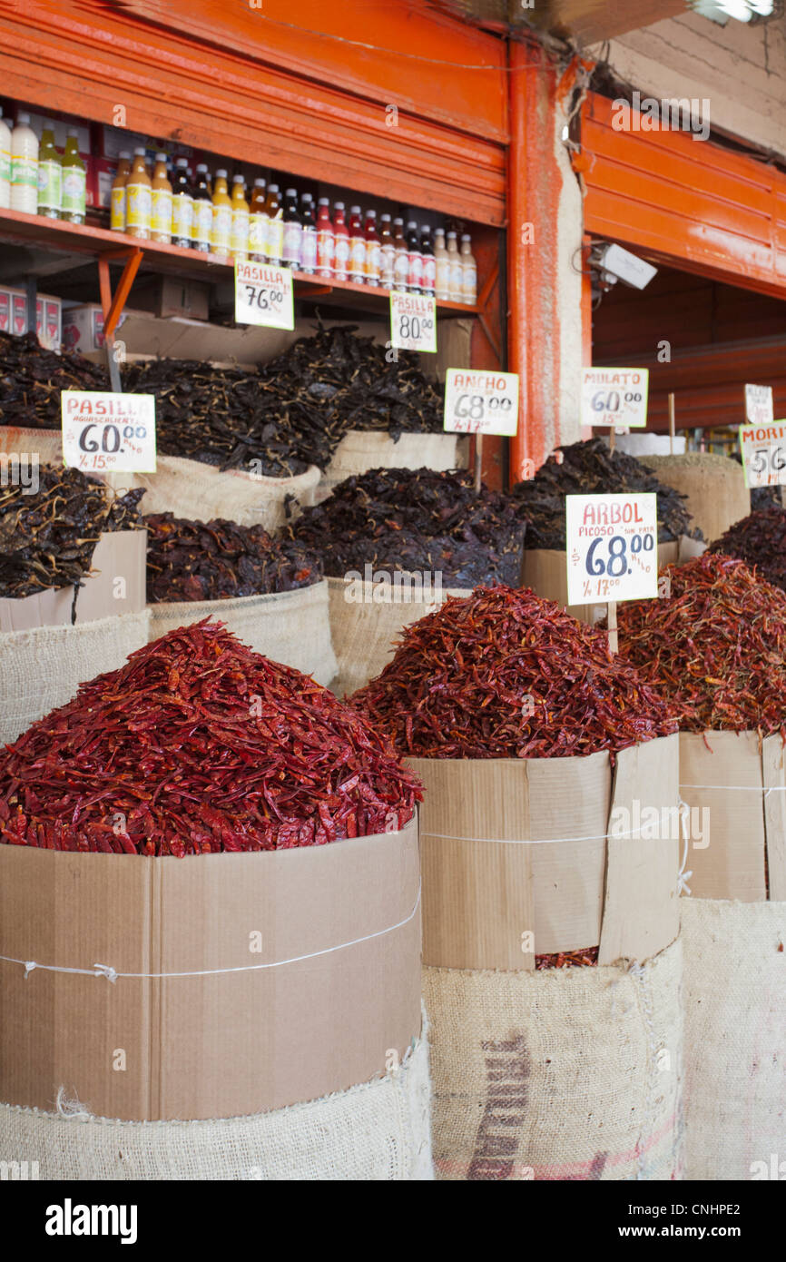 Sacks of various dried chili peppers for sale at an Merced Market, Mexico City Stock Photo