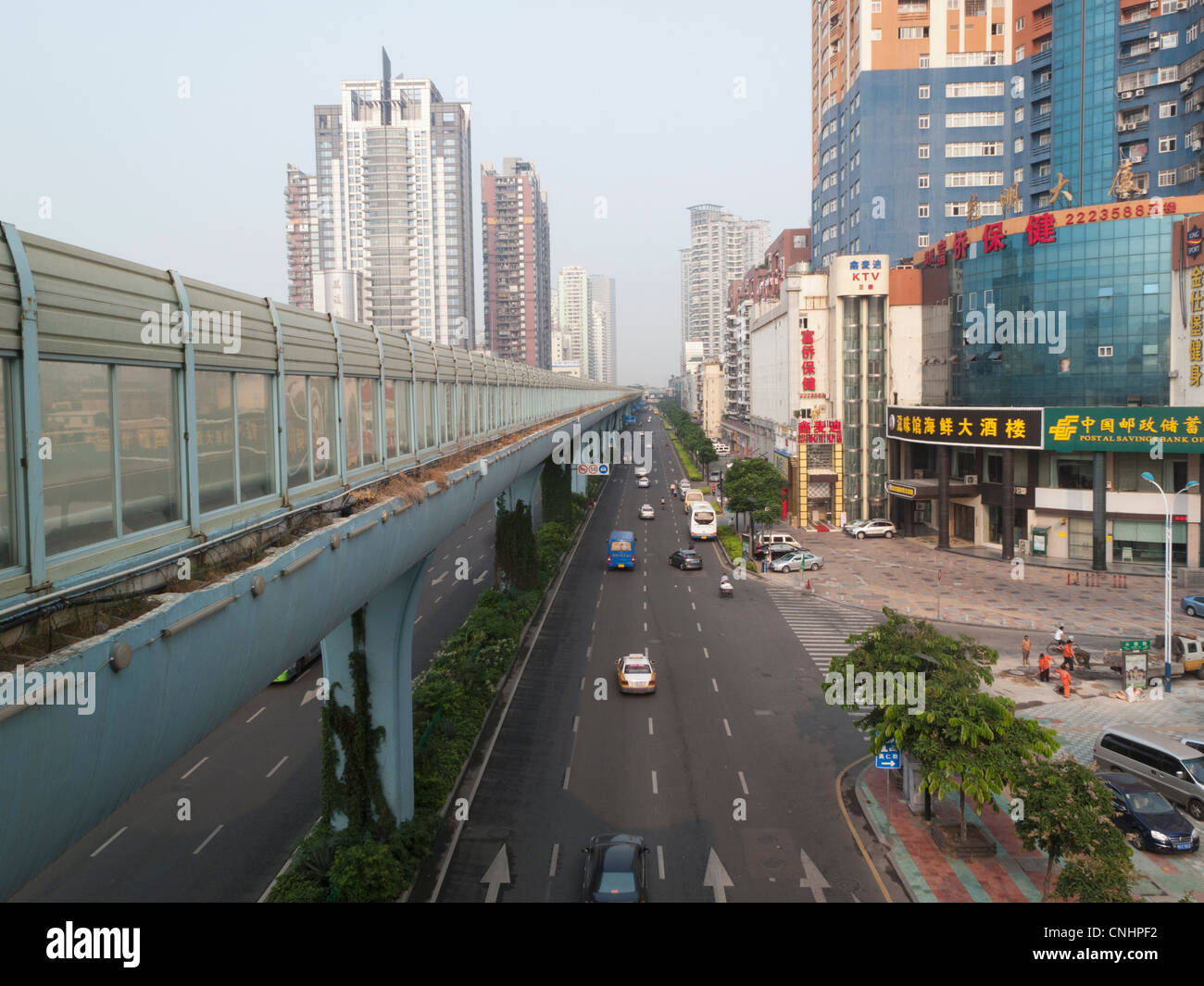 Multiple lane one way street and skyline, Xiamen, China Stock Photo