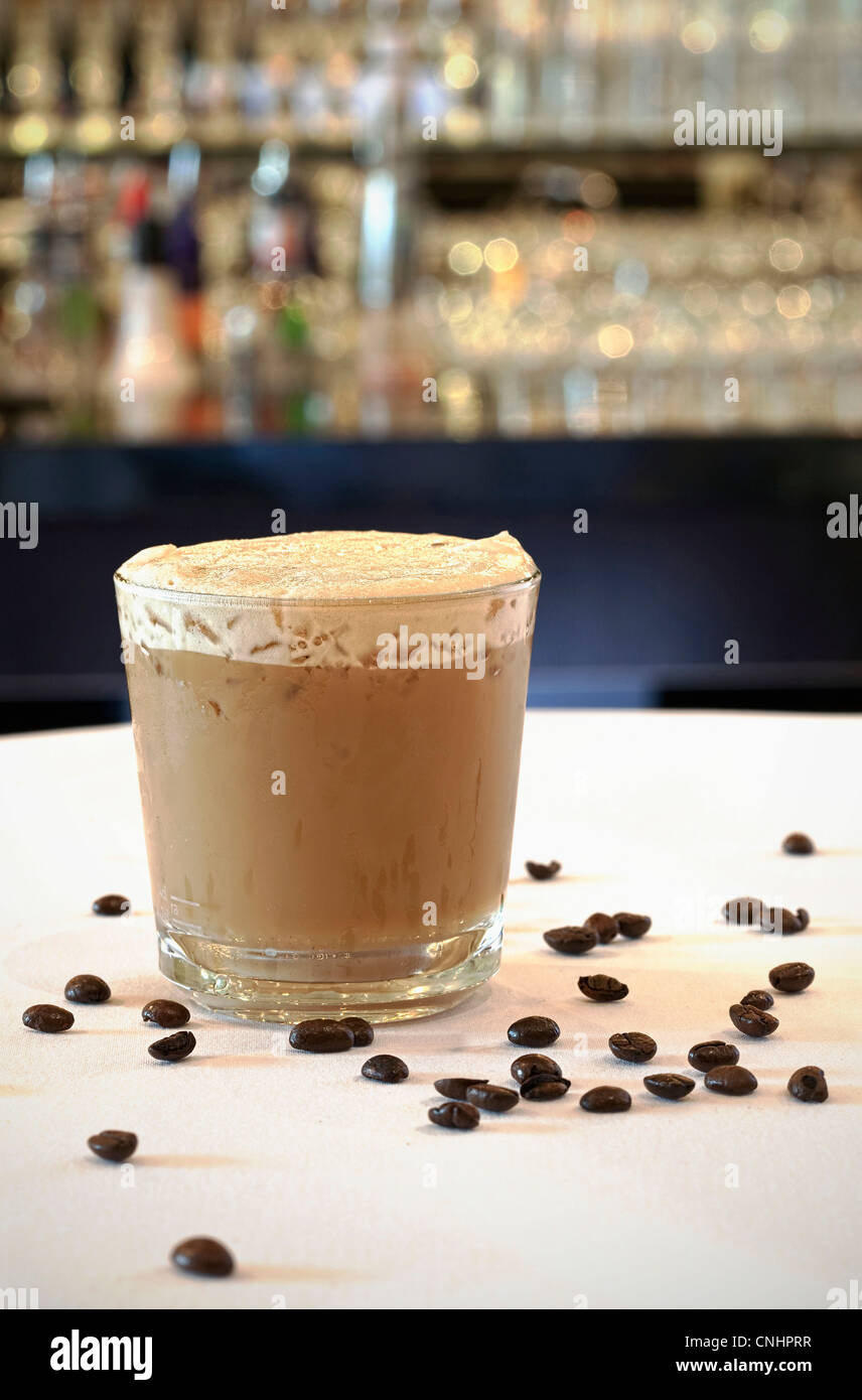 Iced coffee in tall glass. One sweet cold latte with whipped cream, with  chemex coffee maker on dark brown background copy space Stock Photo - Alamy