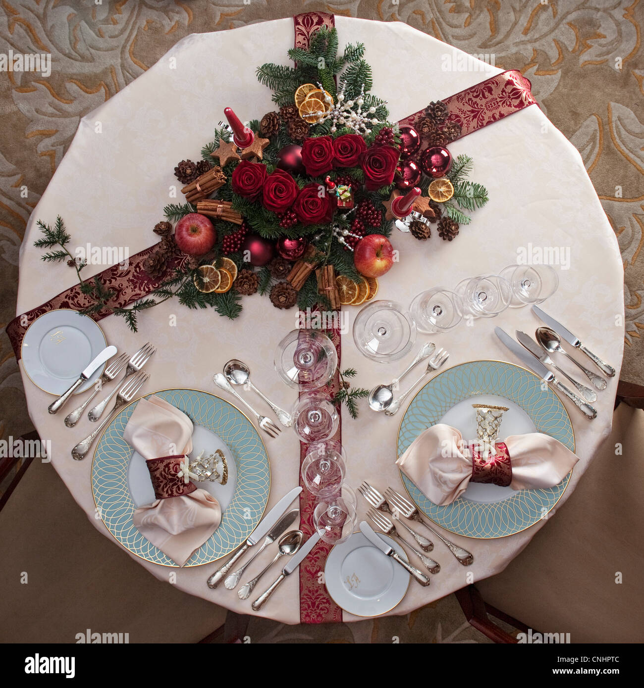 A table set for a Christmas dinner for two Stock Photo