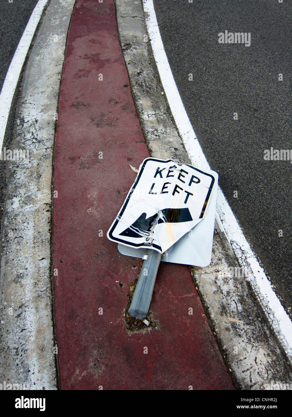 A flattened Keep Left road sign Stock Photo