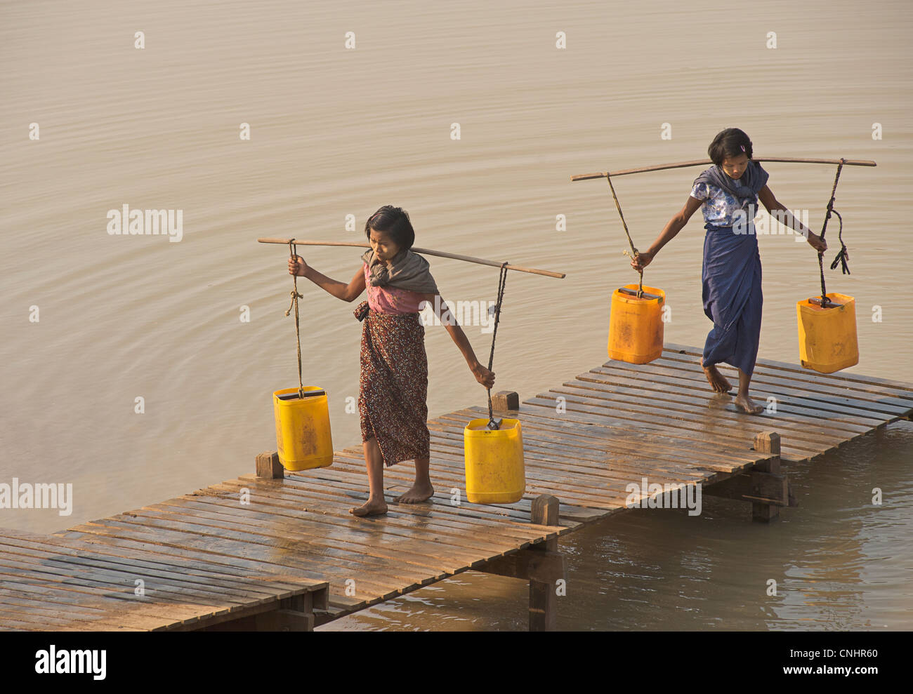 Collecting water from a reservoir between Mount Popa and Bagan Burma. Myanmar. Water Festival preparations Stock Photo