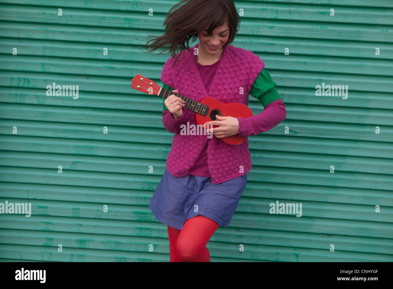 Young woman playing ukulele Stock Photo