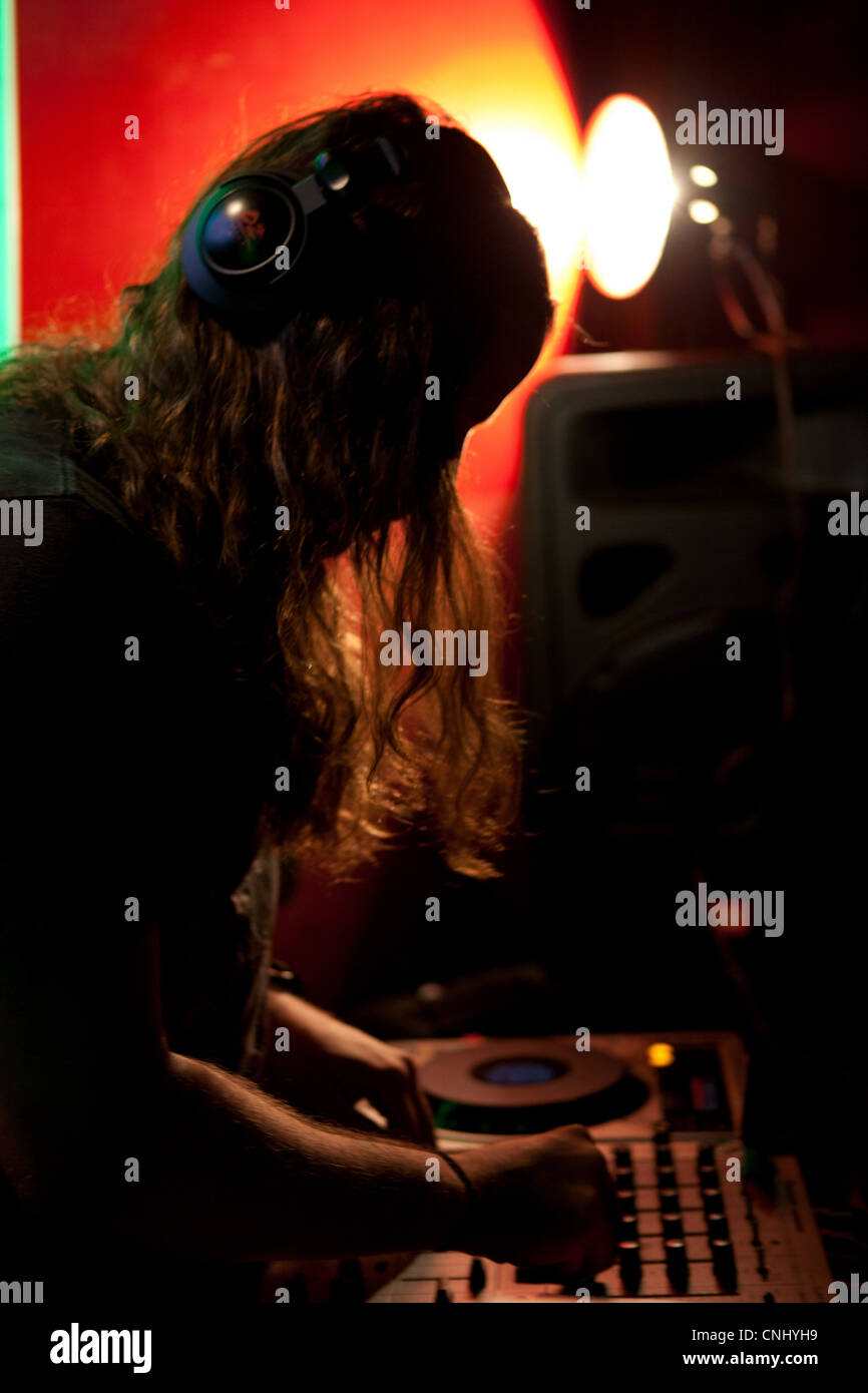 DJ performing in nightclub Stock Photo