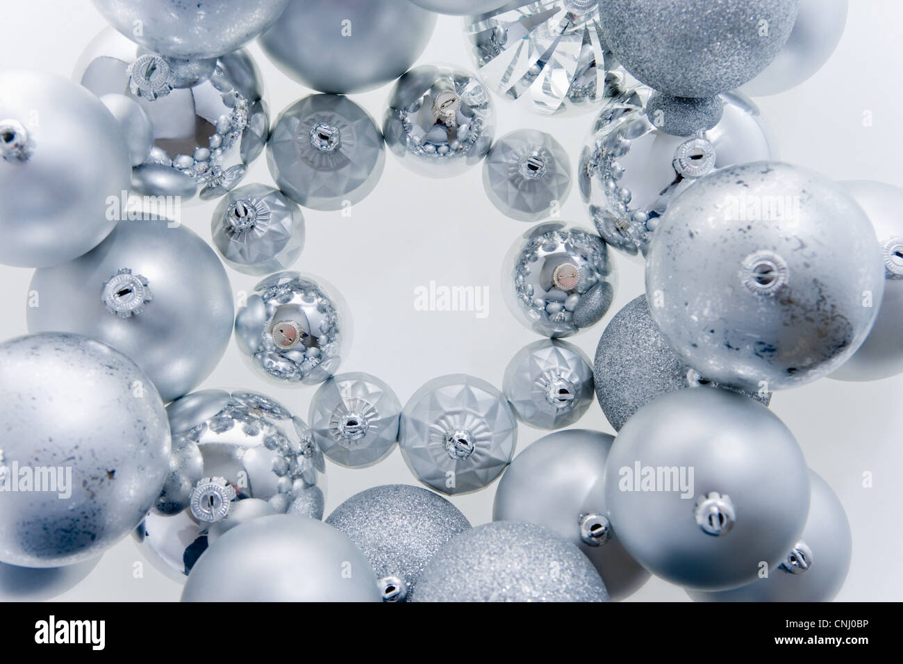 Circle of silver christmas baubles Stock Photo
