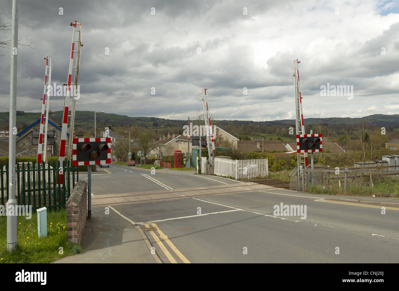 Railway line level crossing road in Llandrindod Wells, Powys Wales UK. Stock Photo