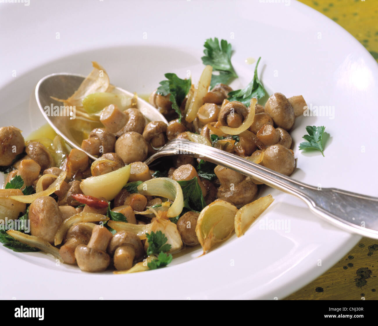 Marinated garlic mushrooms Stock Photo - Alamy