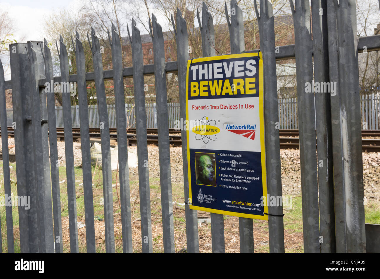 Smartwater in use warning signs near  a railway signalling installation as a deterrent to potential scrap metal thieves. Stock Photo