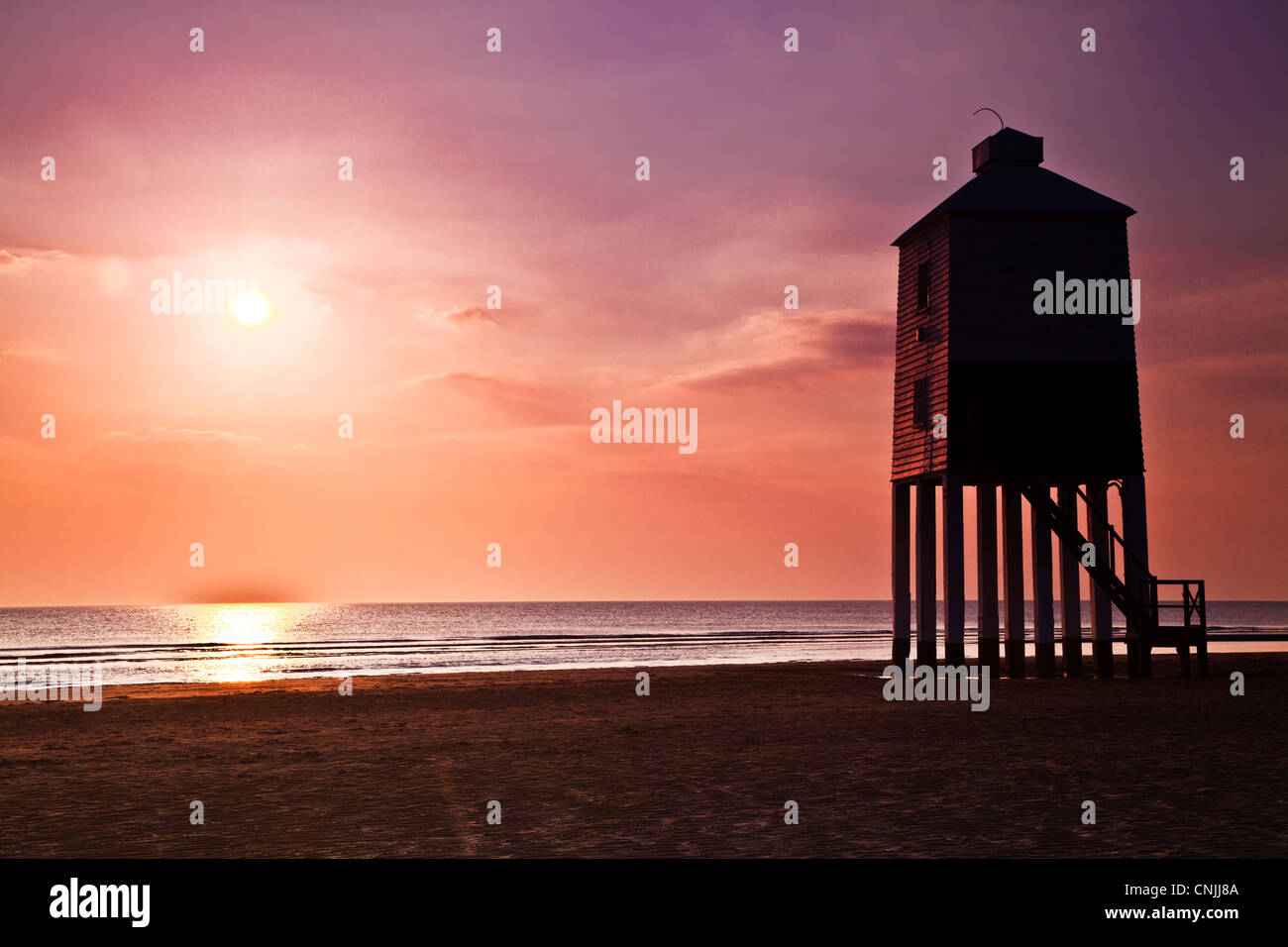 A contre jour shot against the light of the unusual lighthouse on stilts at Burnham-on-Sea, Somerset, England, UK, at sunset. Stock Photo