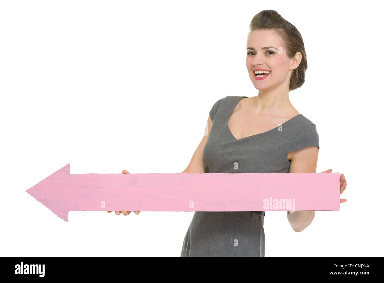 Happy business woman with big arrow pointing in corner. HQ photo. Not ...