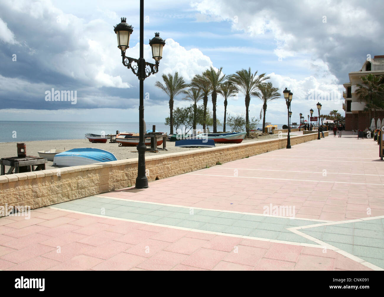 Sunny promenade along beach, Sabinillas, Costa del Sol, Southern Spain Stock Photo