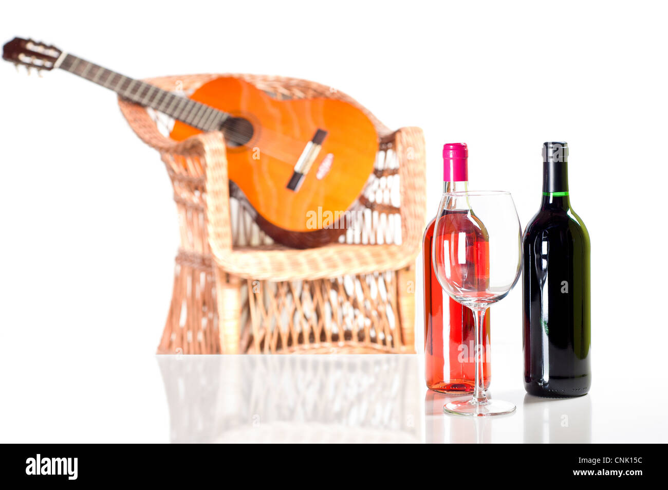 Two bottles of red wine and one glass Stock Photo - Alamy