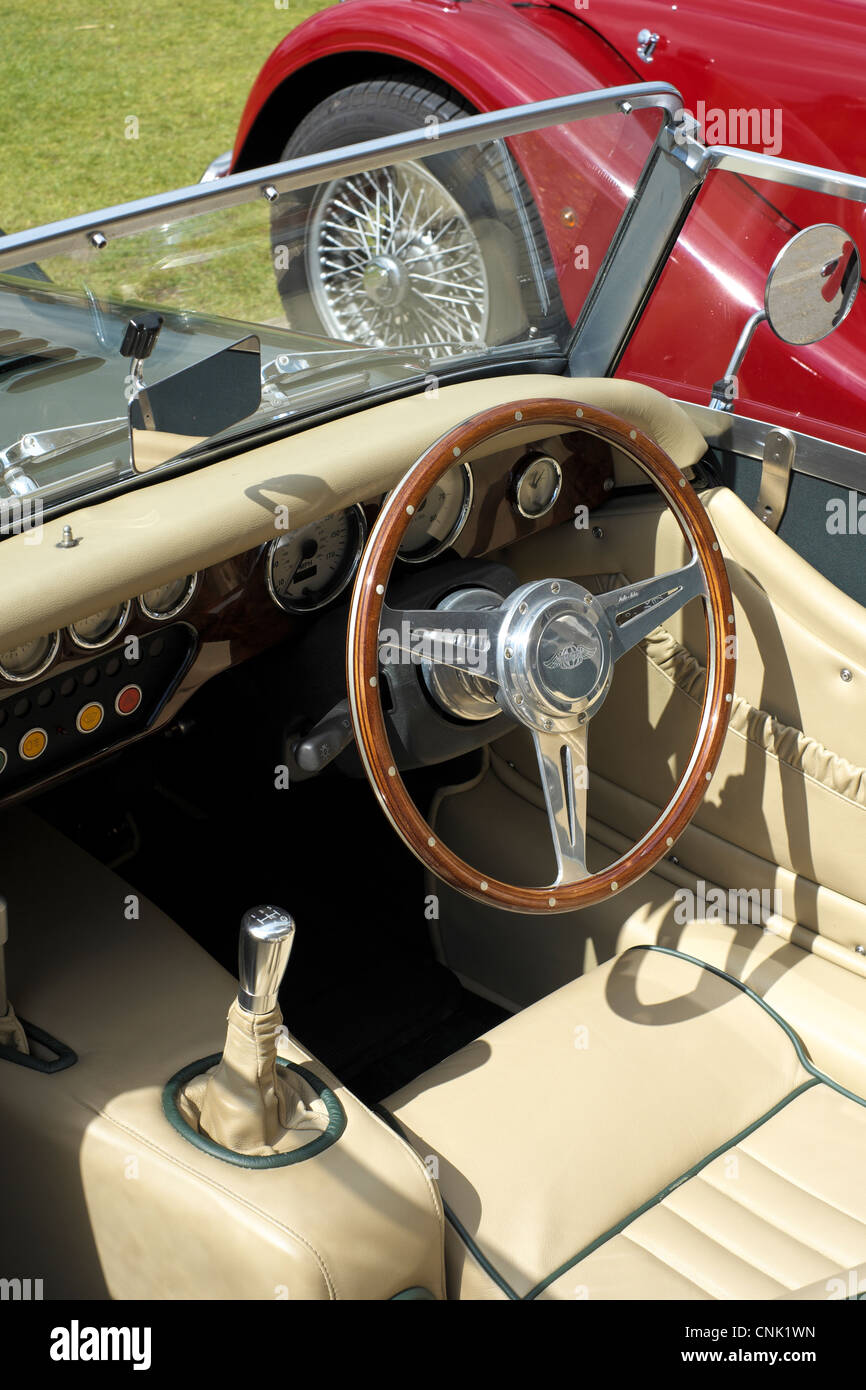 sports car cockpit with steering wheel and dashboard Stock Photo