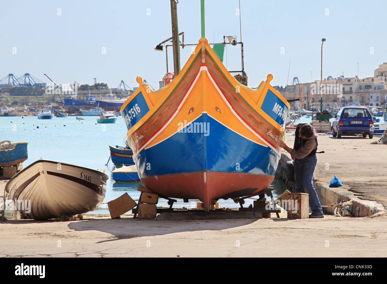 Fisherman Painting His Colourful Wooden Boat Marsaxlokk Harbour Malta Europe Stock Photo Alamy