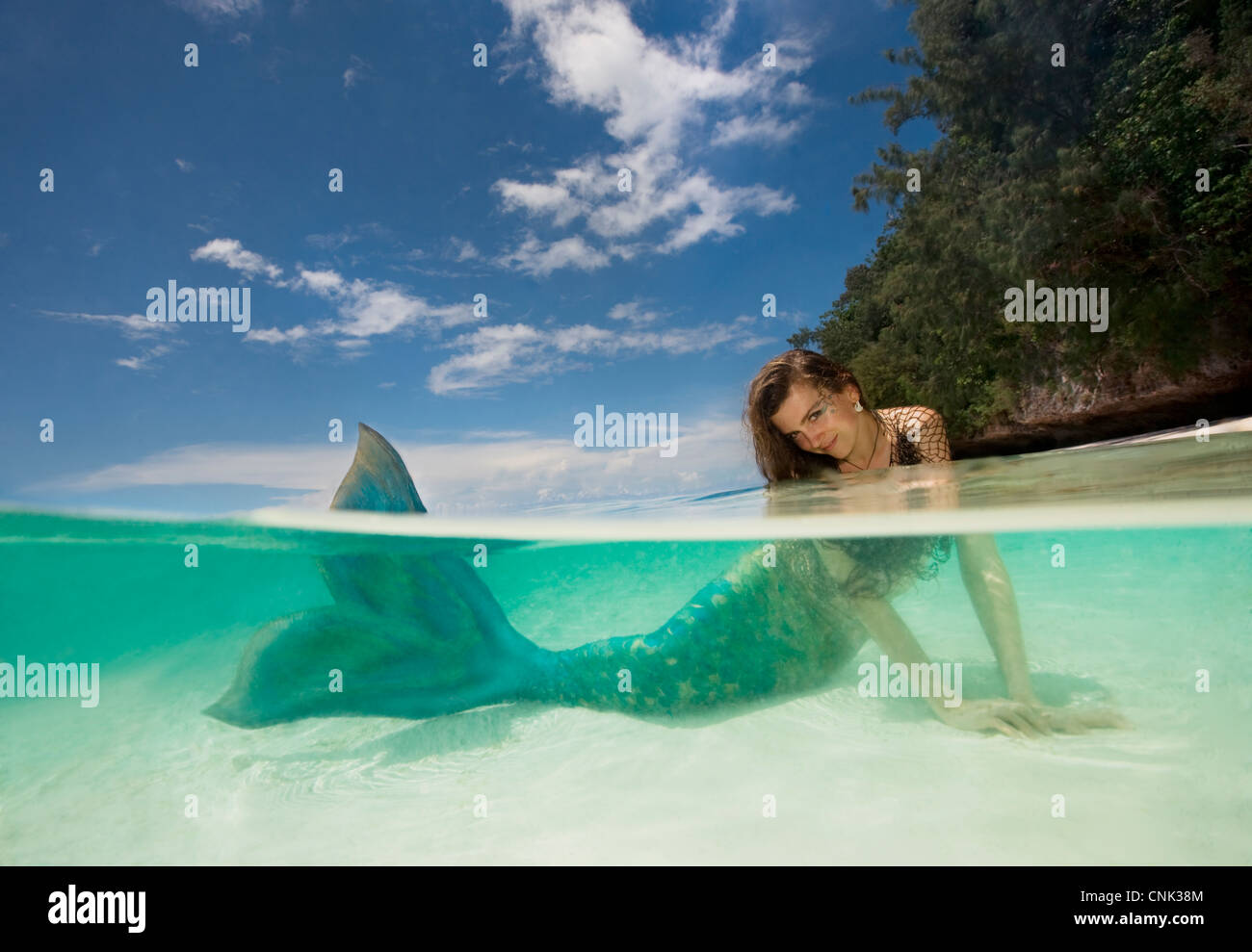 British mermaid in shallow water at Ulong Beach, site of TV show Survivors, Rock Islands, Palau, Micronesia Stock Photo
