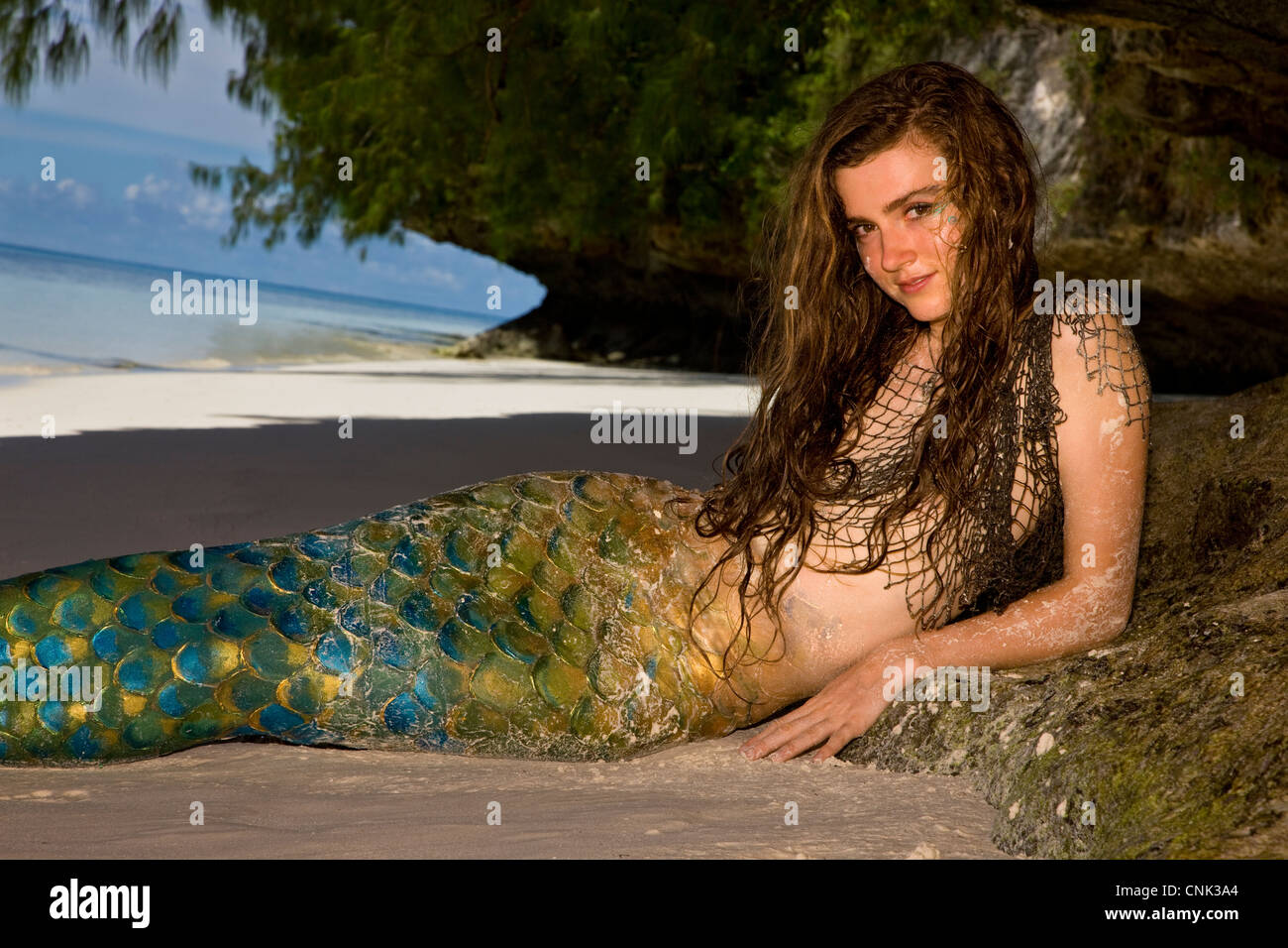 British mermaid under rock ledge at Ulong Beach, site of TV show Survivors, Rock Islands, Palau, Micronesia Stock Photo