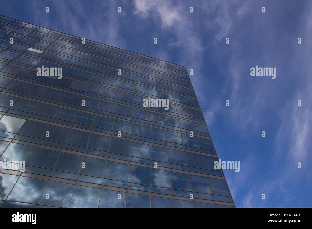 Picture of a tall buildning with reflections from the sky Stock Photo ...