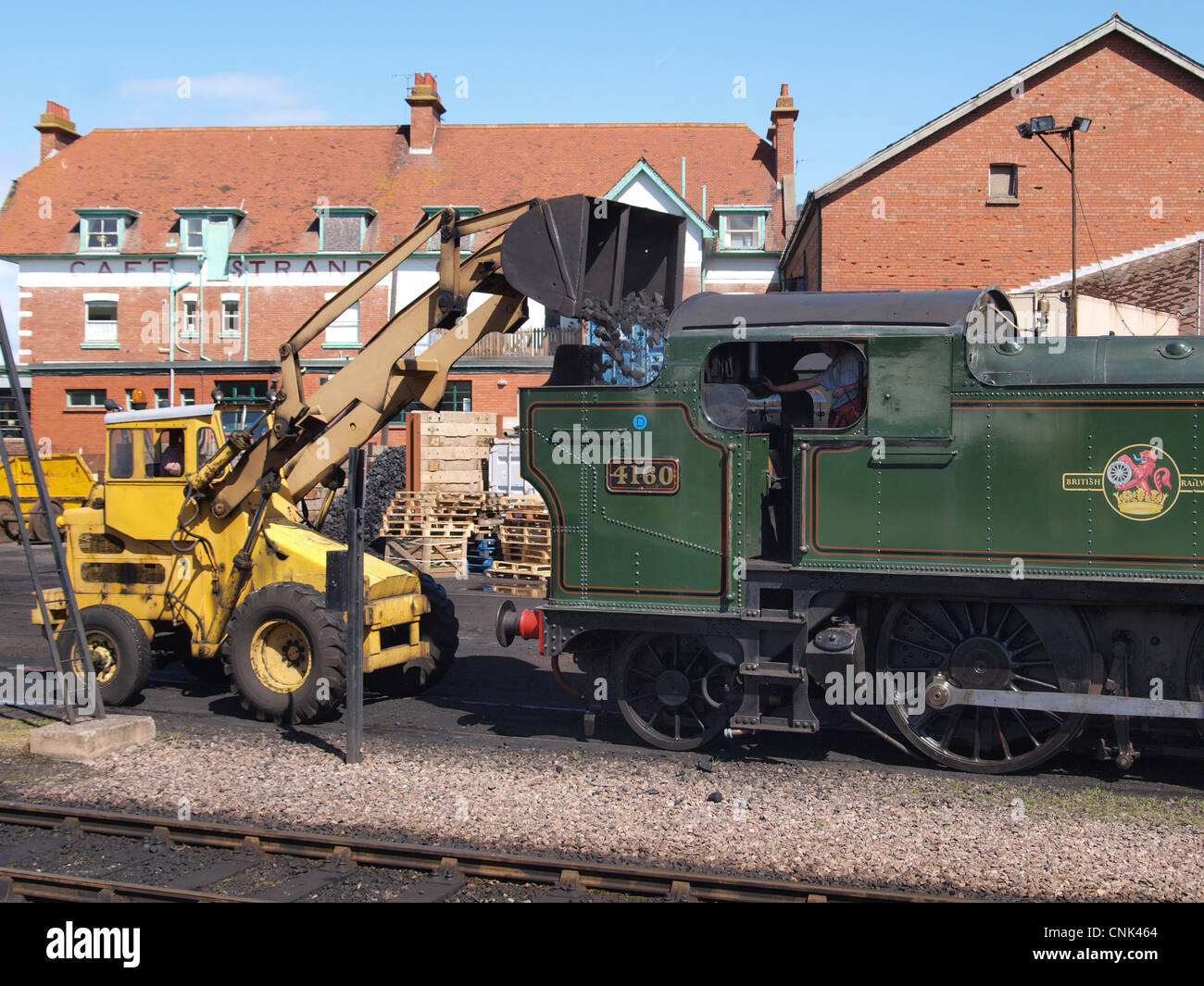 Locomotive being filled with coal. Minehead Station. Somerset Stock Photo