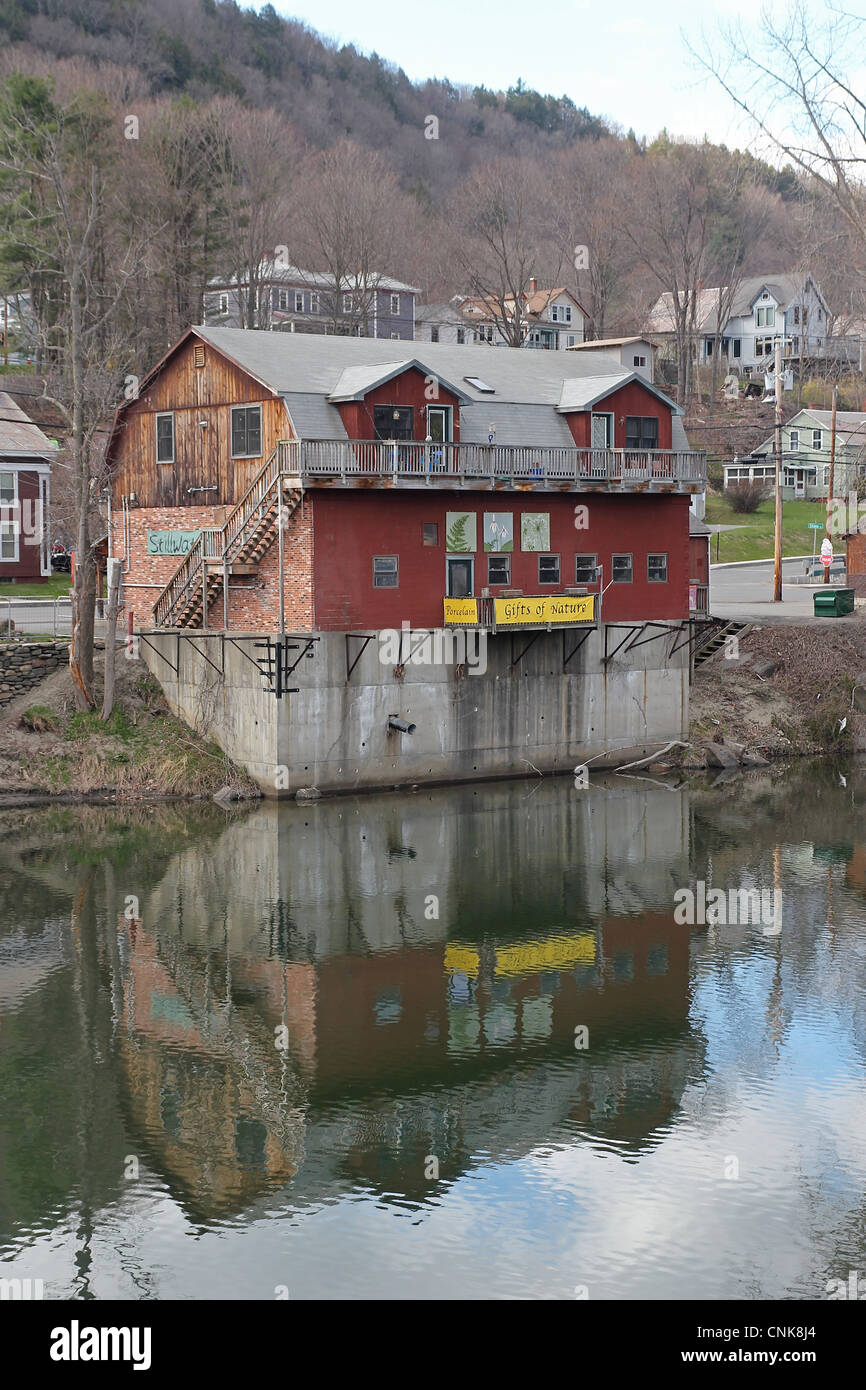 The building housing Stillwater Art and Design, reflected in the