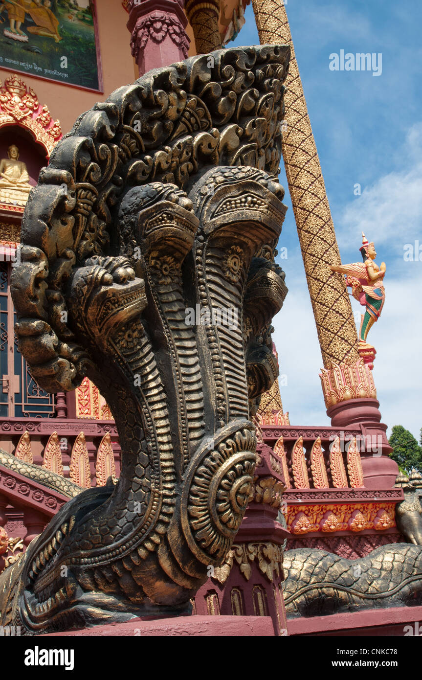 Naga sculpture, the mythological many headed snake, protectingthe entrance of Wat Set Tbo in Kandal Province, Cambodia. Stock Photo