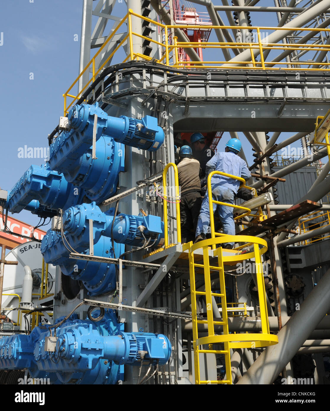 Replace damaged parts on oil rig Stock Photo - Alamy