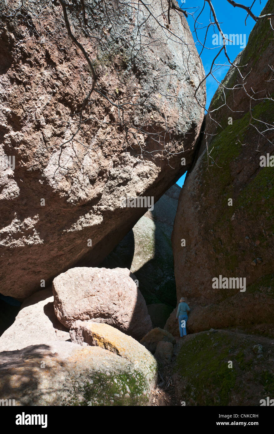 California, Pinnacles National Monument, female hiker on Balconies Trail. Stock Photo