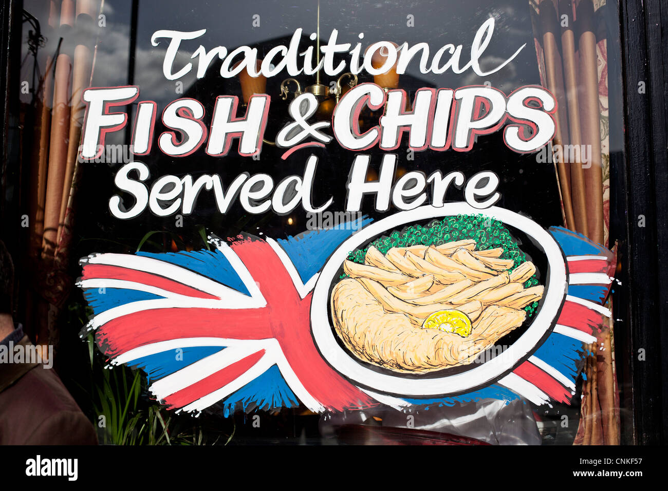 Fish and chips sign on a restaurant window, London, England, UK. Stock Photo