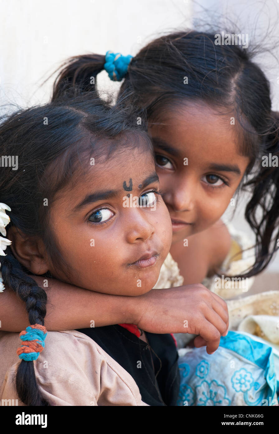 Young poor lower caste Indian street girls smiling Stock Photo