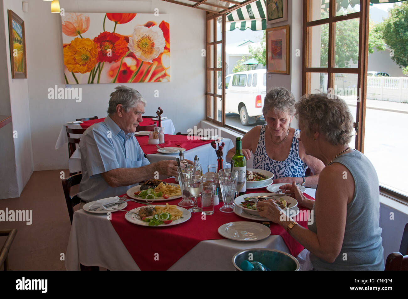 People eating lunch in a restaurant. Stanford town centre Western Cape