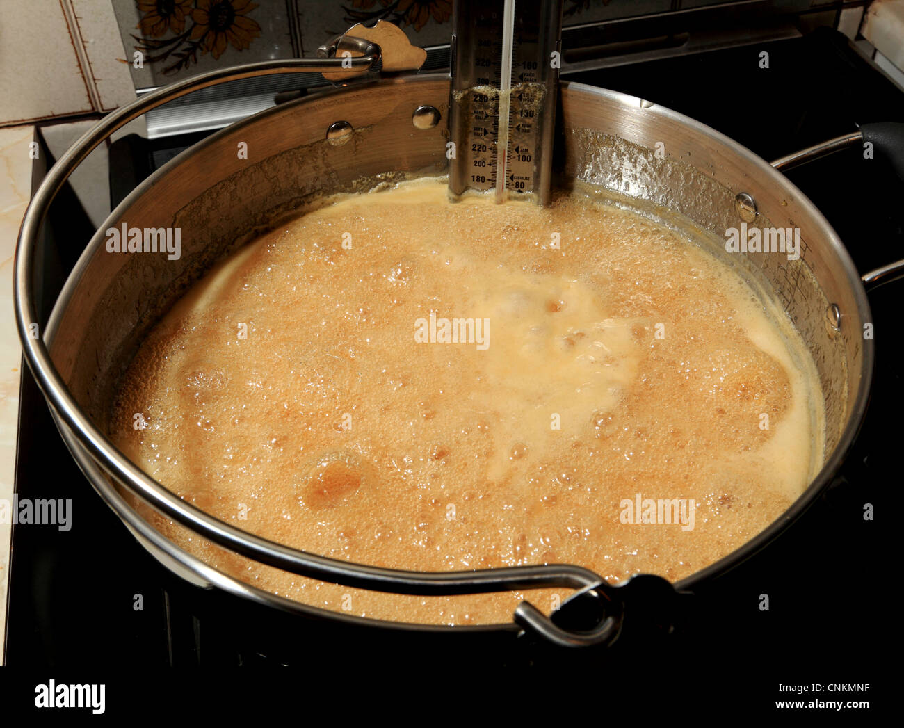 3735. Marmalade making, rolling boil at 106c Stock Photo
