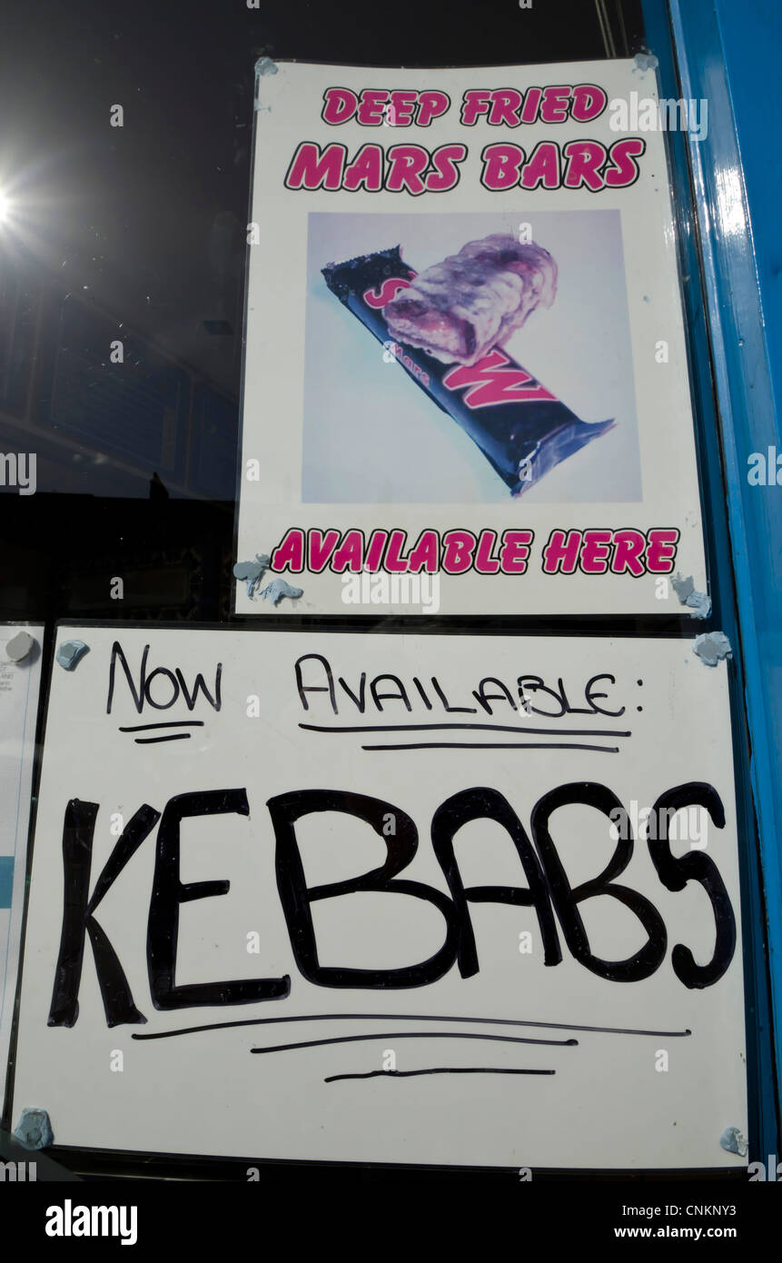 Signs advertising DeepFried Mars Bars and Kebabs in the chip shop in Central Edinburgh