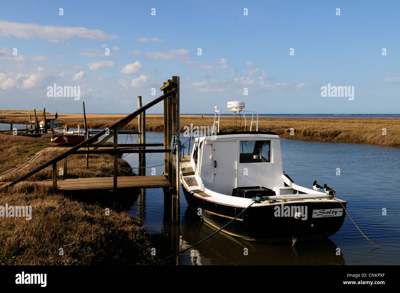 Boats in The Harbour, Thornham, Norfolk, England, UK Stock Photo