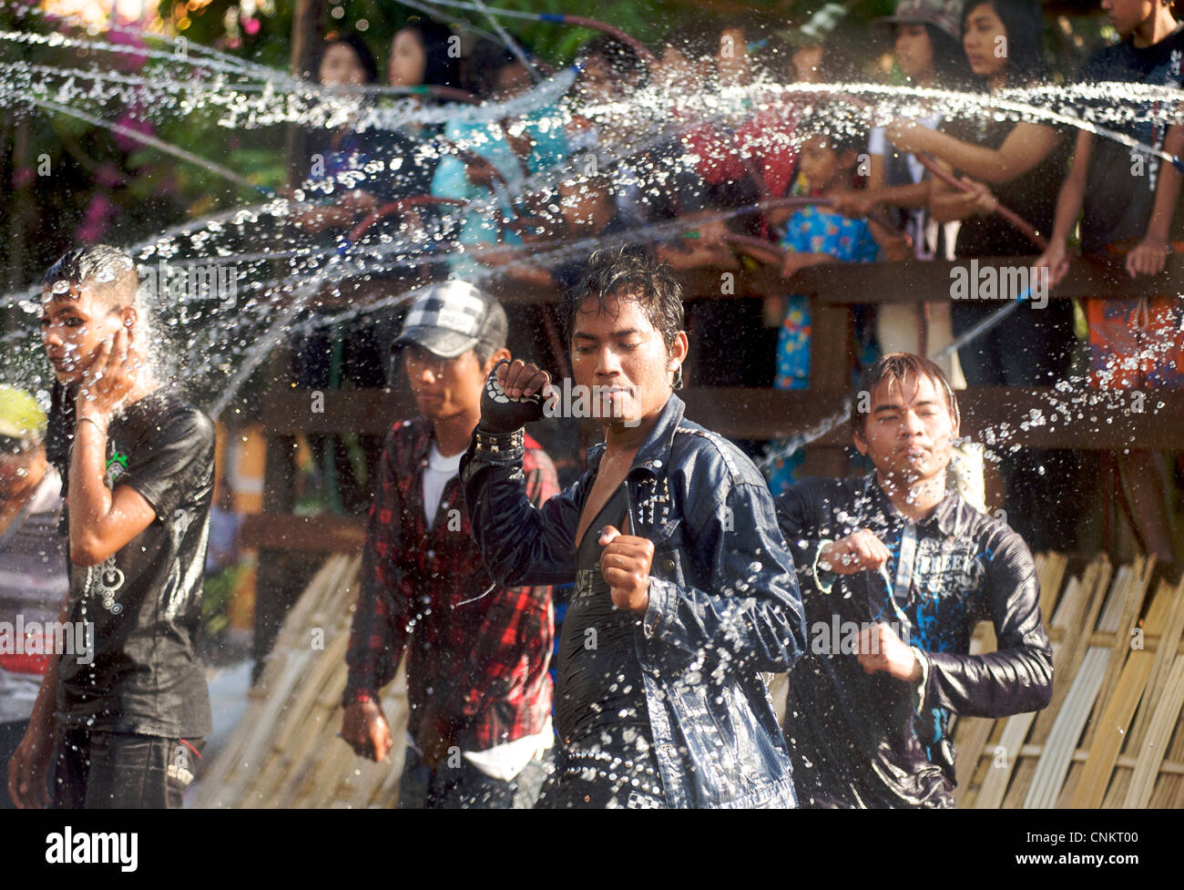 Water Festival, Burma. Burmese youth enjoying the festivities at Meikila. dancing in the street. Stock Photo