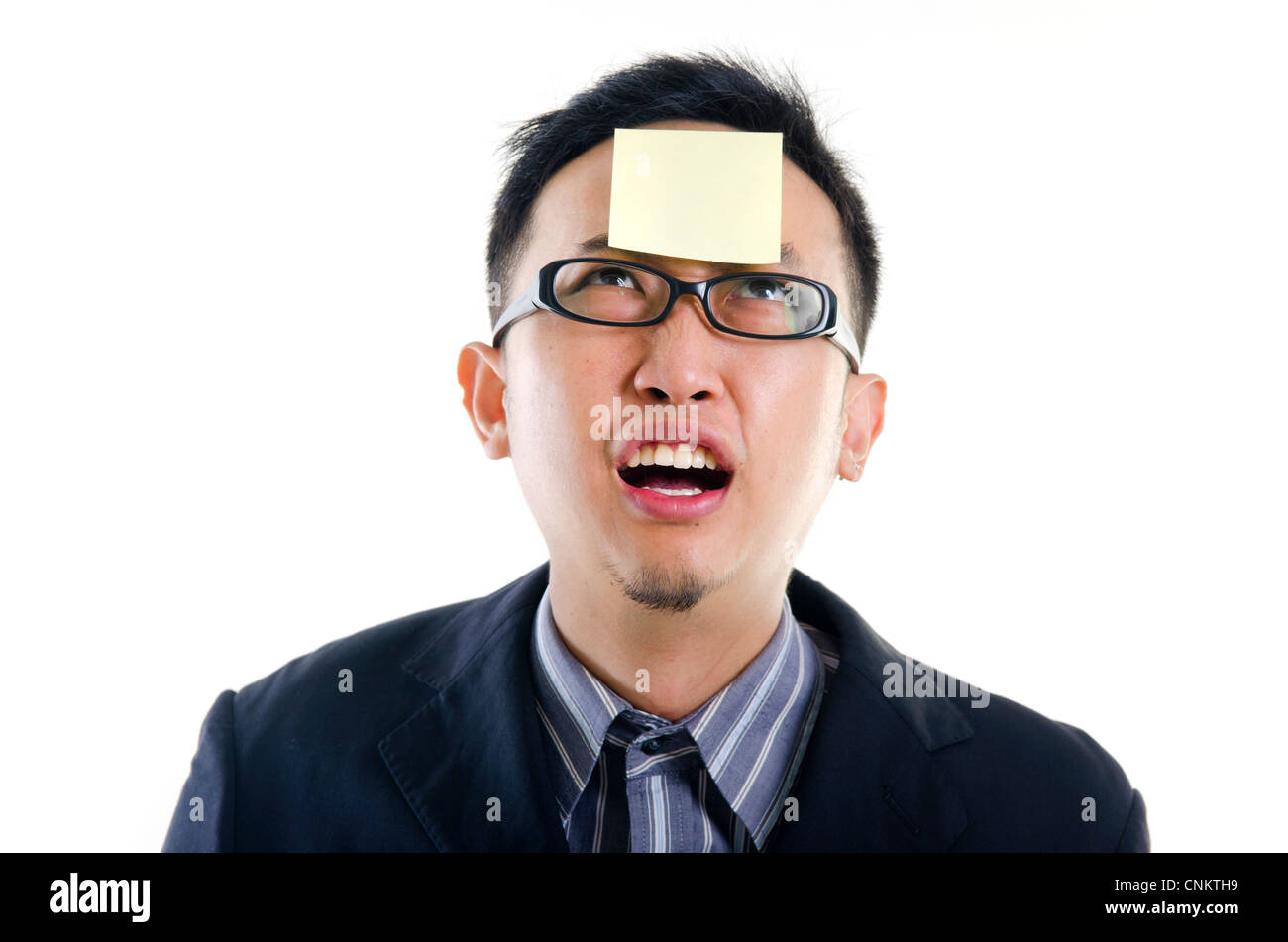 young businessman helpless looking the post it Stock Photo