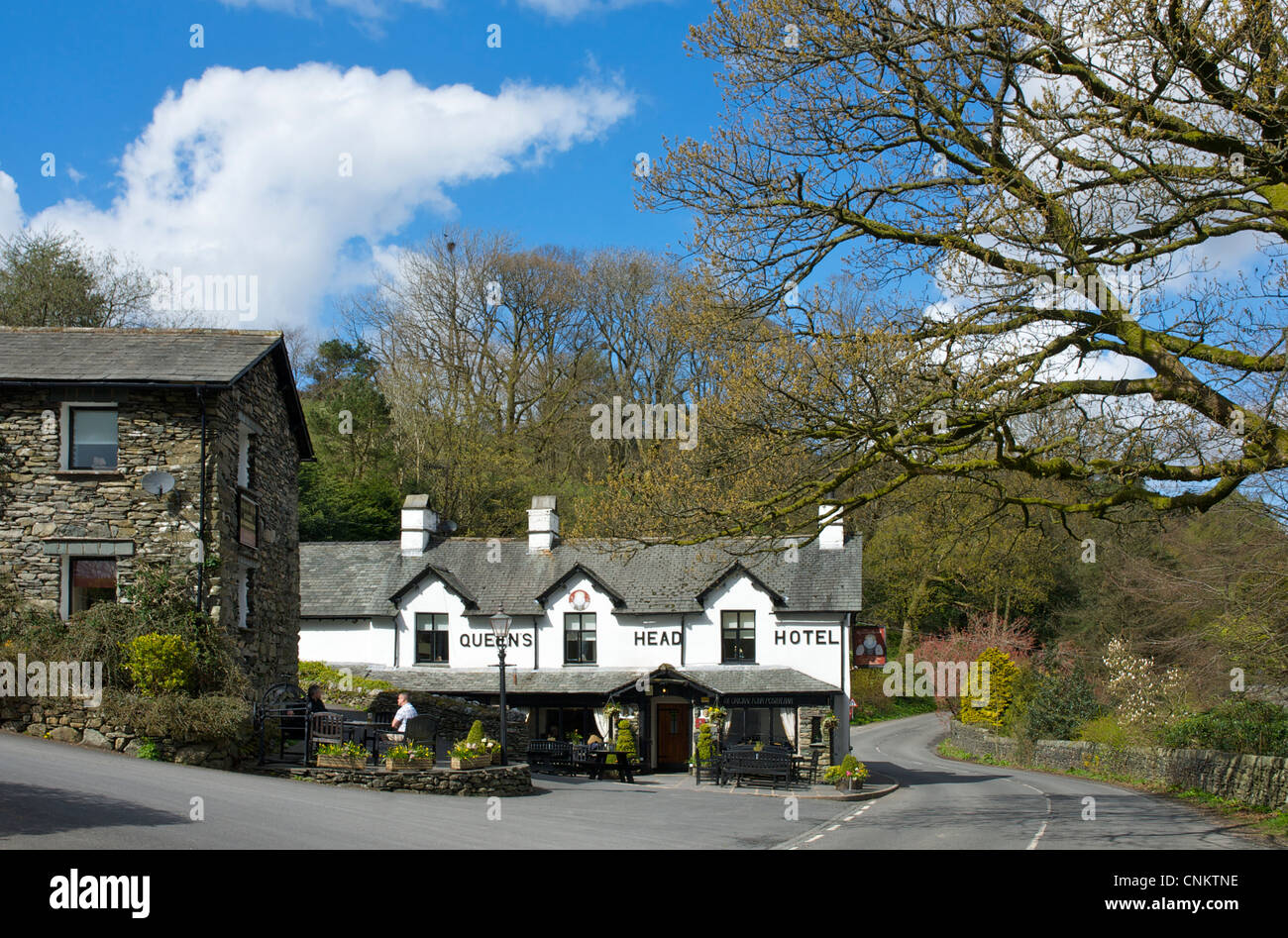 Drinkers outside the Queens Head Hotel, in the village of Troutbeck