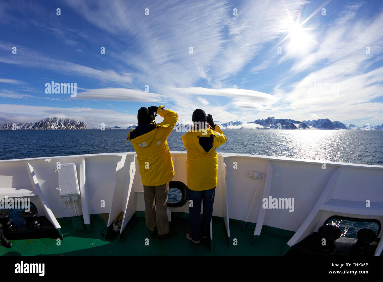 Tourists taking photographs on board the  polar expedition ship, Akademik Sergey Vavilov, of southern Spitzbergen Arctic Stock Photo