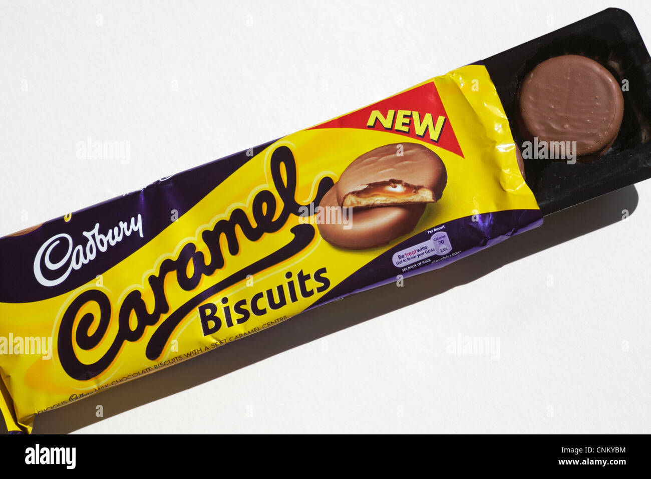 packet of  new Cadbury Caramel biscuits with packet opened to show contents set on white background Stock Photo