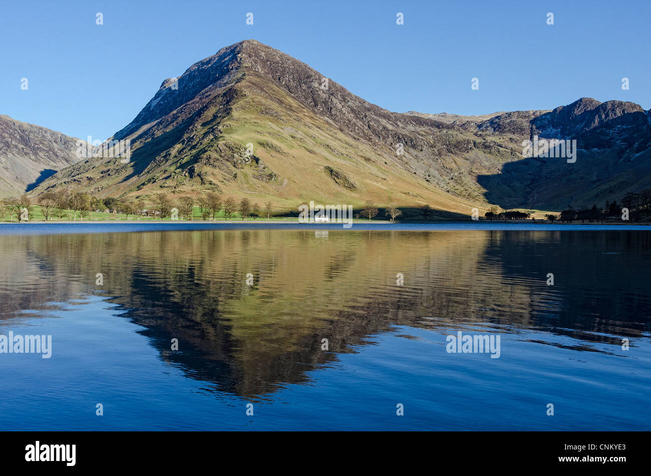 Fleetwith Pike reflected in Buttermere. Stock Photo
